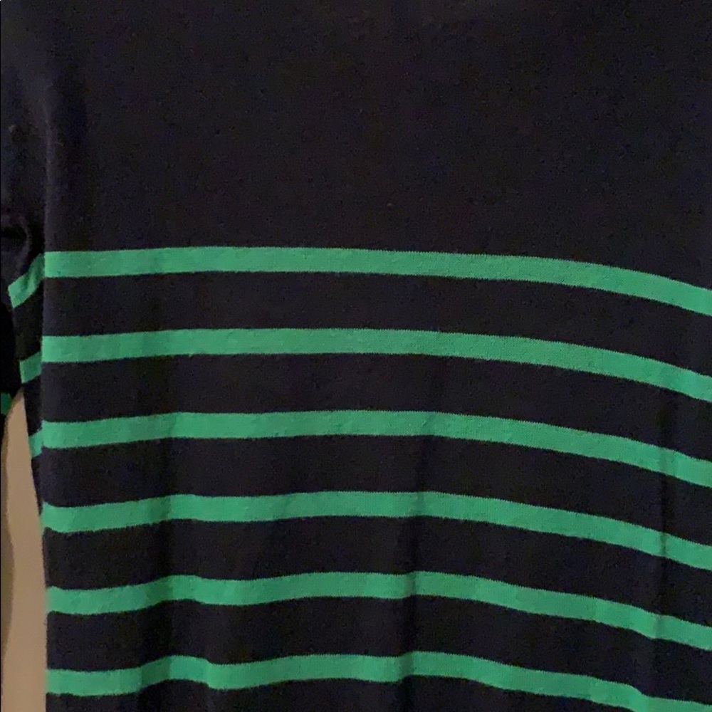 Thin sweater with green stripes.
